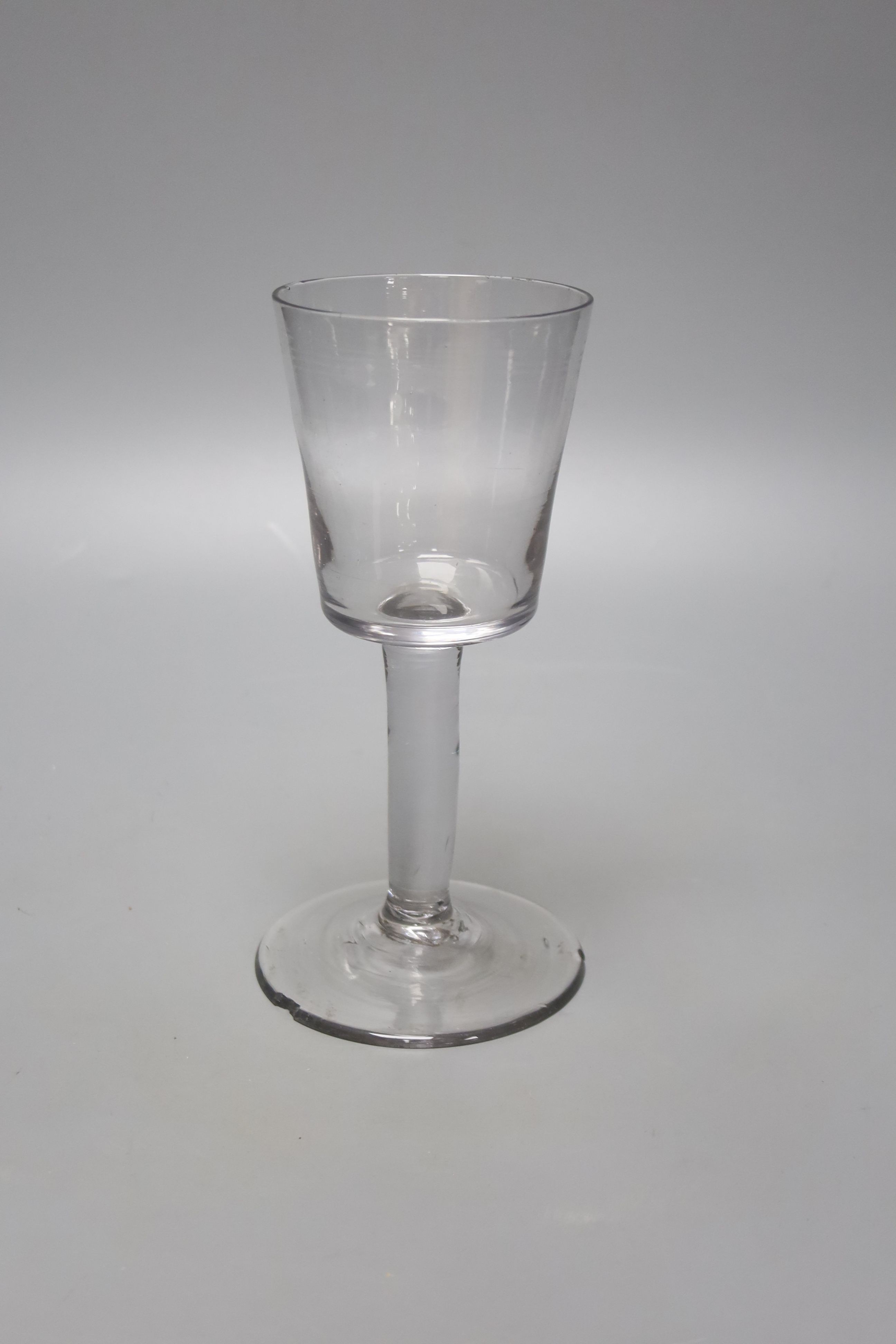 A mid 18th century glass wine goblet, bucket bowl, height 21cm